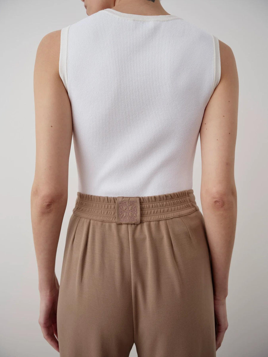 Back view of Emello's Balloon Popper Trousers in taupe, featuring a gathered waistband and a tailored finish.
