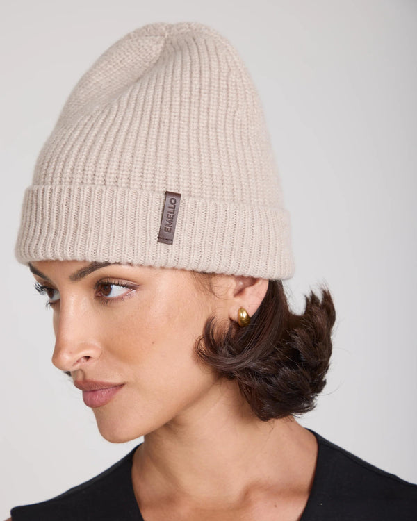 Refined beige Emello beanie crafted in Italy, featuring a fold-over cuff and soft leather label.