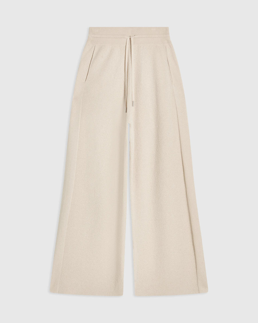 Emello Bouclé Wide Leg Trousers in Cream, showcasing a flowy silhouette and ribbed waistband.