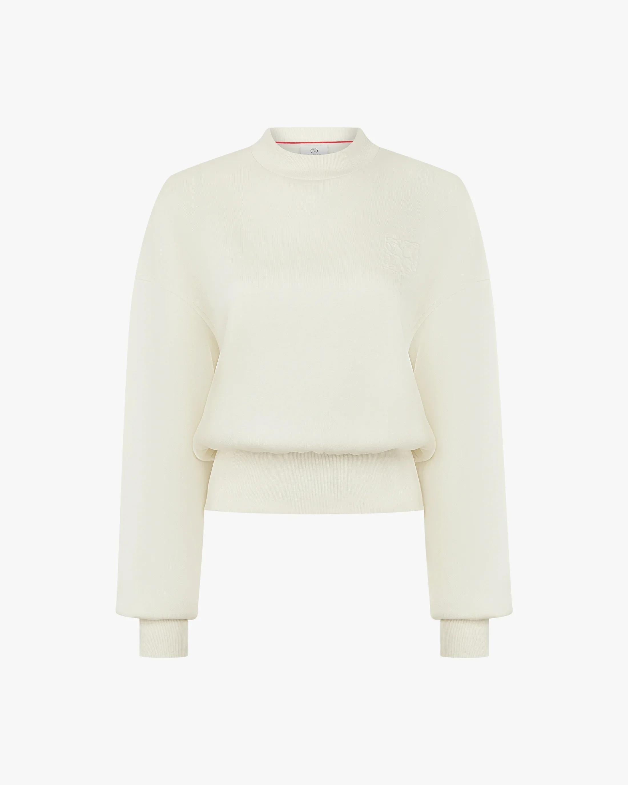 Elegant cream sweatshirt with debossing crafted from buttery-soft lyocell fleece, featuring a relaxed fit and refined details.