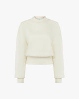 Elegant cream sweatshirt with debossing crafted from buttery-soft lyocell fleece, featuring a relaxed fit and refined details.
