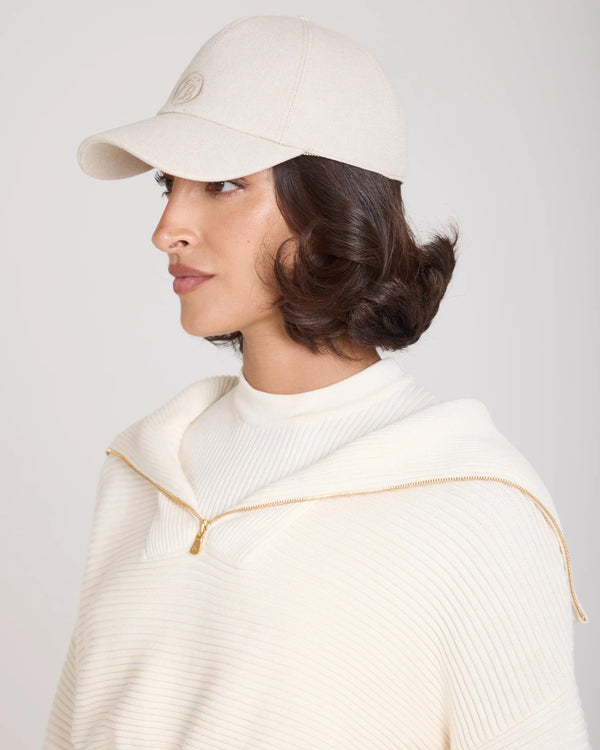 Emello Cap in Beige crafted from brushed cotton twill with a pale gold disc embellishment.
