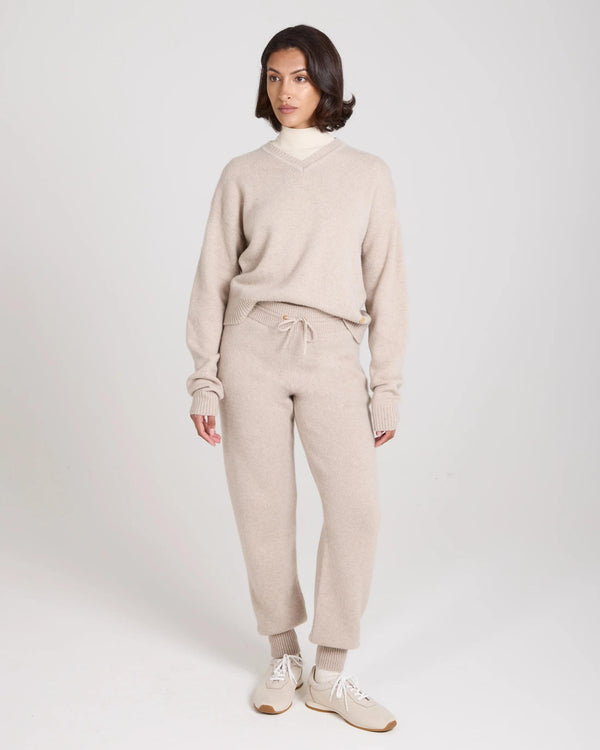 Model wearing Kasima Cashmere Blend Knit Trousers in Beige