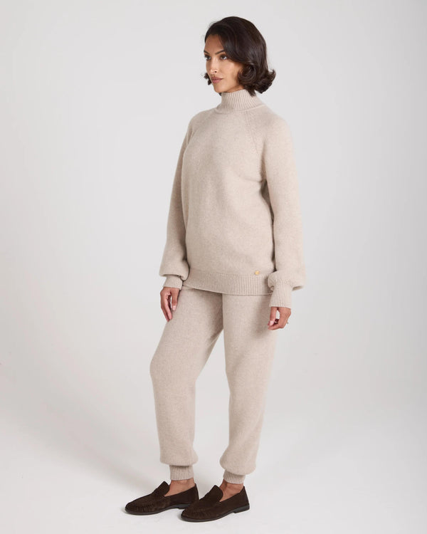 Emello Kasima Cashmere Blend Knit Sweater in beige, featuring a relaxed fit with a rib funnel neck and long sleeves.