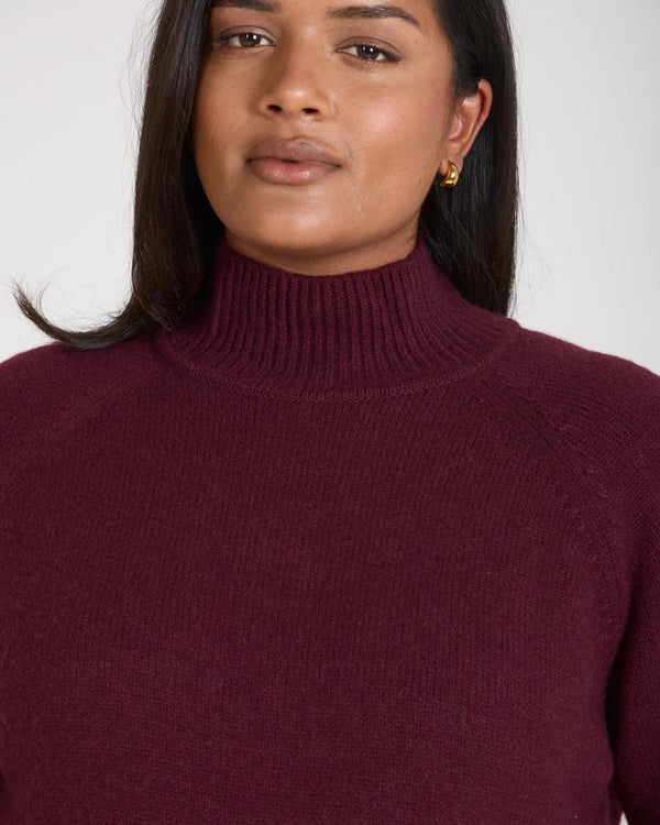 Kasima Cashmere Blend Knit Sweater in luxurious fig, showcasing a relaxed fit and folded rib funnel neck.