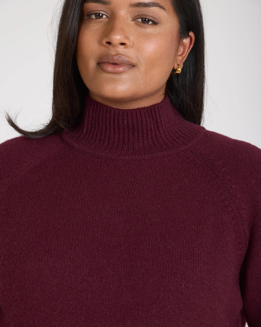 Kasima Cashmere Blend Knit Sweater in luxurious fig, showcasing a relaxed fit and folded rib funnel neck.
