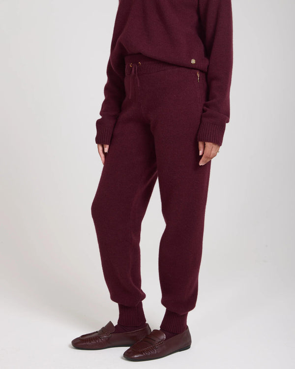 Emello Kasima Cashmere Blend Knit Trousers in Fig, featuring ribbed cuffs and a relaxed fit, crafted in Italy.