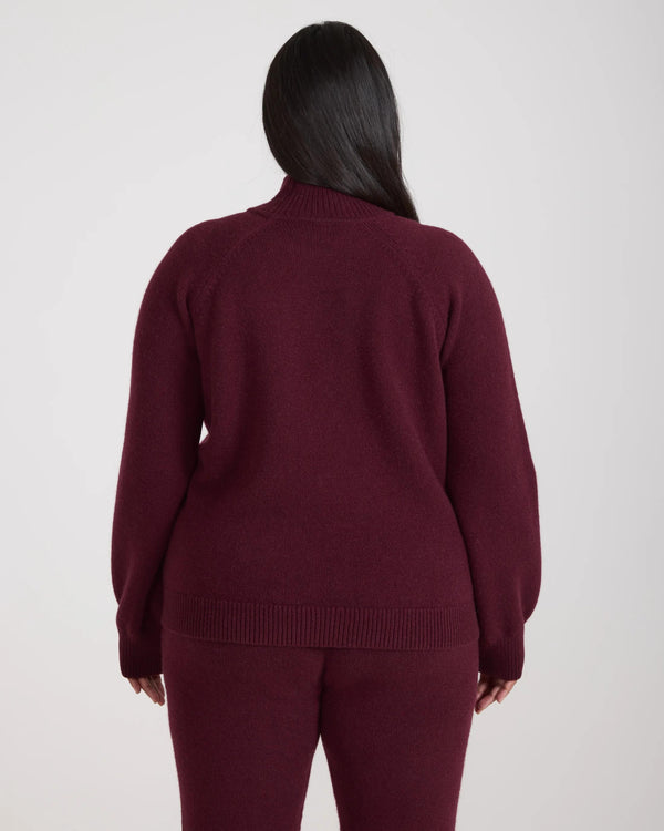 Back view of the Kasima Cashmere Blend Knit Sweater in rich fig, showcasing its sculptural design and luxurious finish.