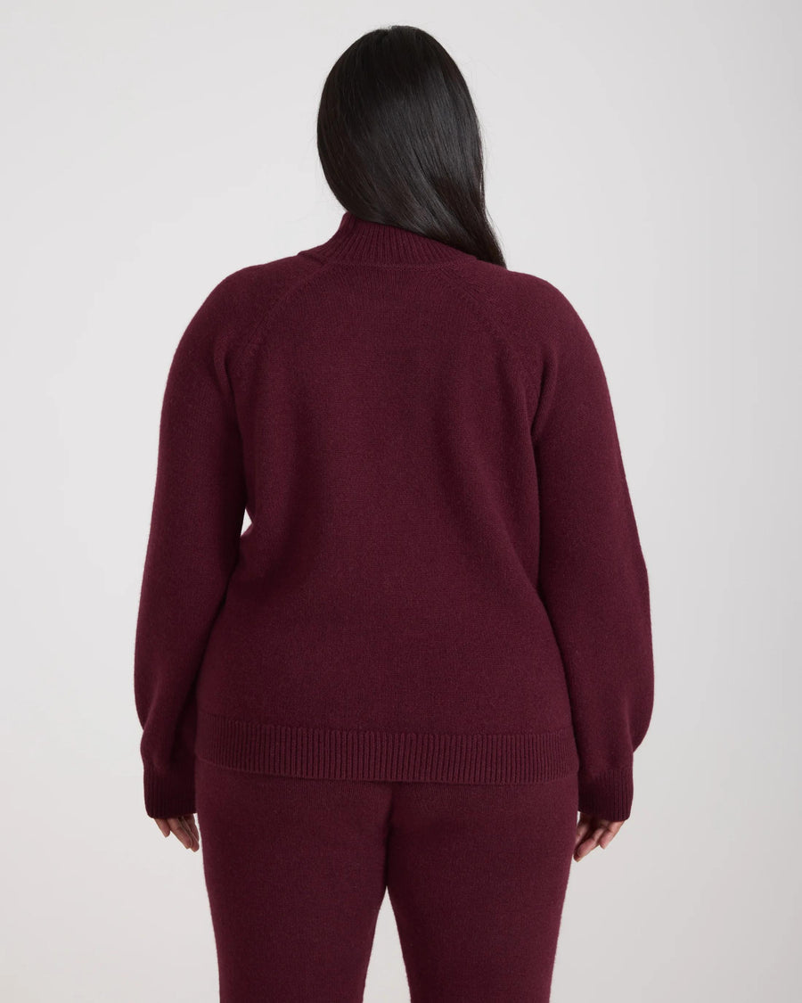Back view of the Kasima Cashmere Blend Knit Sweater in rich fig, showcasing its sculptural design and luxurious finish.