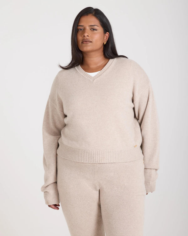 Kasima Cashmere Blend V Neck Sweater in Beige, featuring a relaxed fit with a deep V neckline, crafted in Italy.