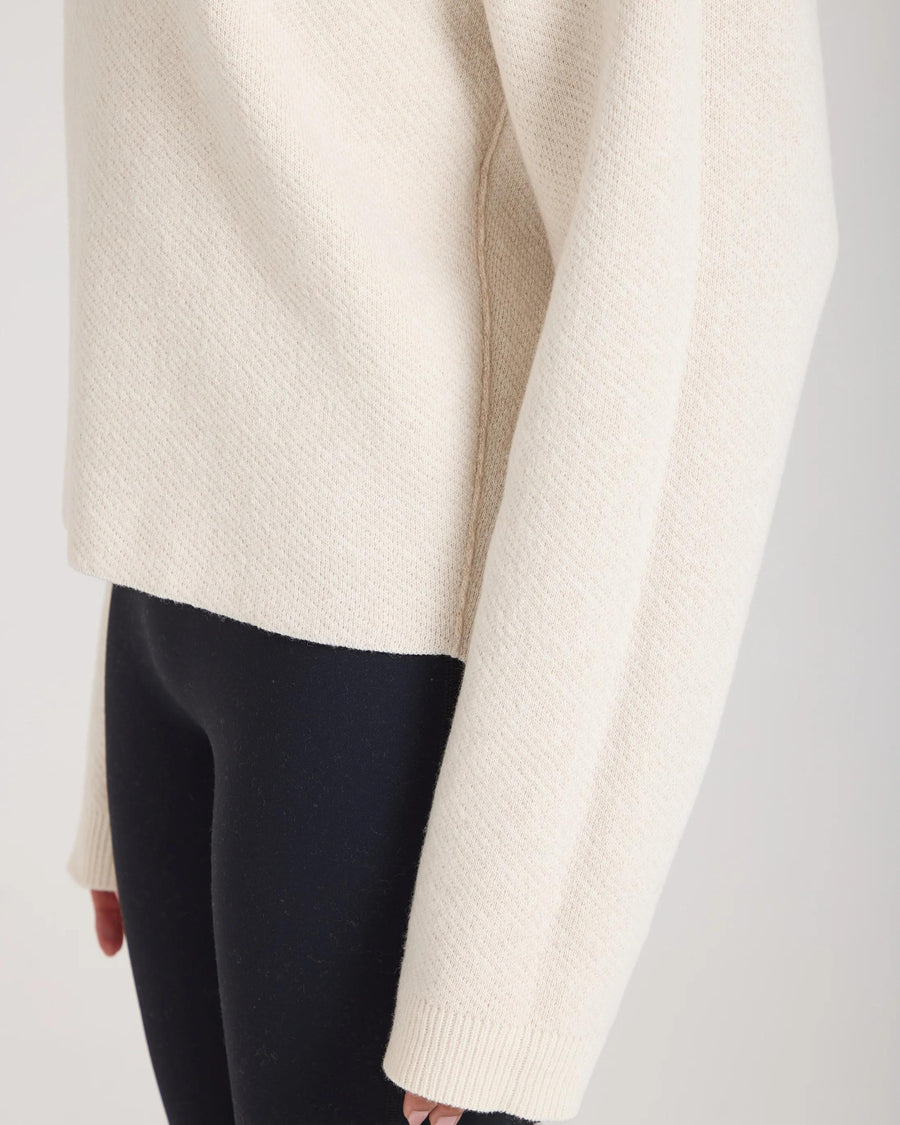 Reversible Cream Jacquard Cashmere Sweater in cashmere and merino wool blend, worn by a model showcasing elegant texture