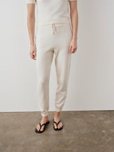 Cotton Cashmere Knit Trousers by Emello showcasing a relaxed and refined cream silhouette.