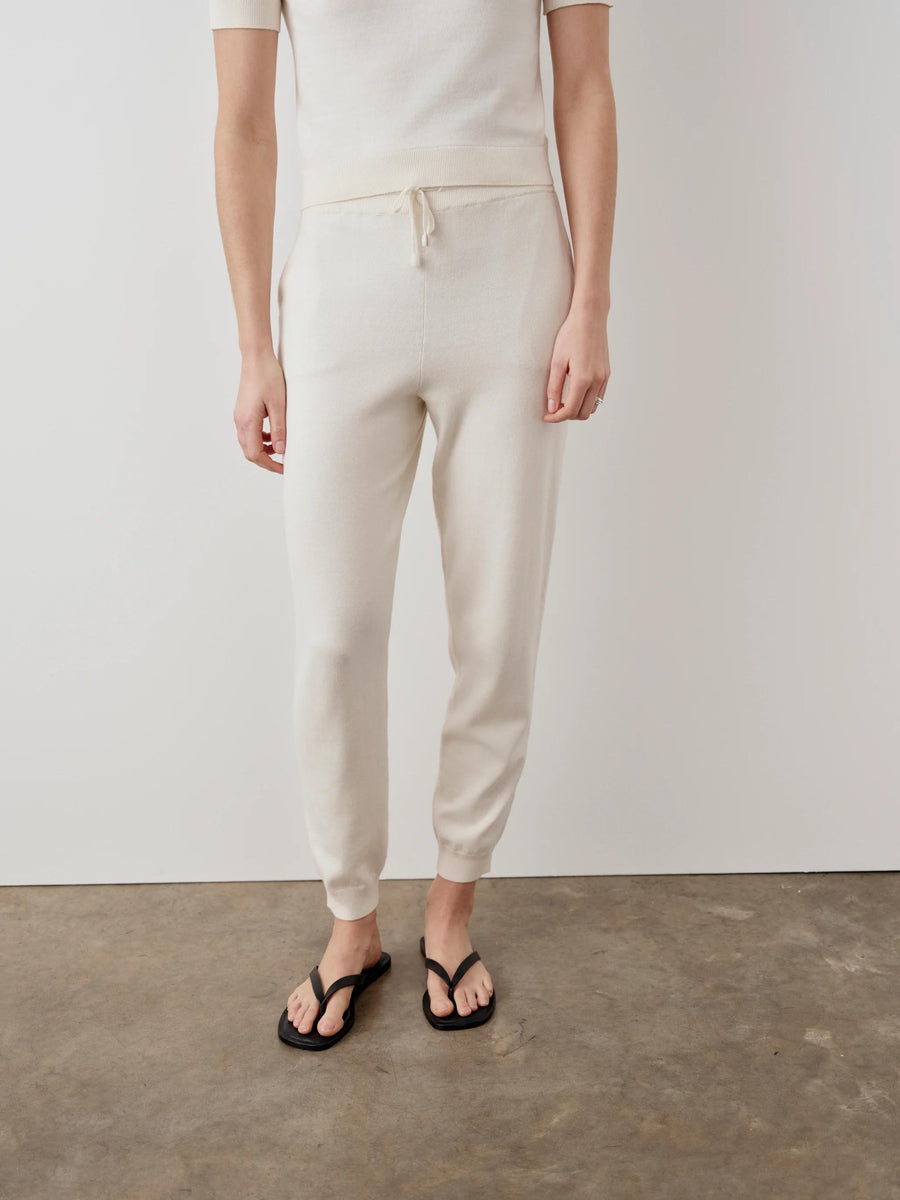 Cotton Cashmere Knit Trousers by Emello showcasing a relaxed and refined cream silhouette.