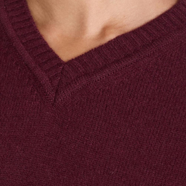 Close-up of a V-neck burgundy knit sweater in soft brushed cashmere