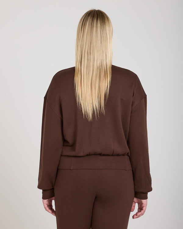 Back view of Emello's chocolate Lyocell fleece zip-through jacket, showcasing relaxed fit and soft drape.