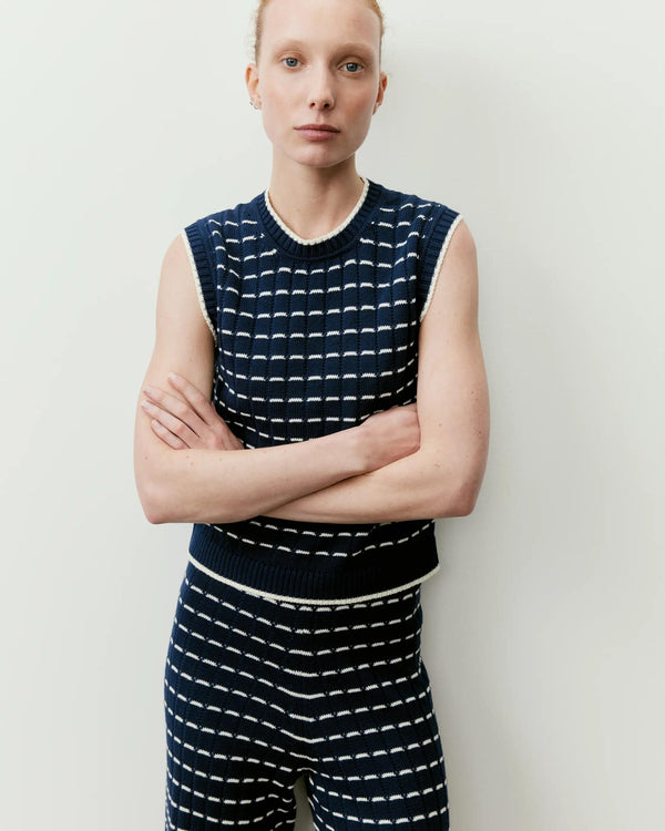 Emello Contrast Pointelle Knit Vest in navy and cream, featuring a grid stitch and structured shoulders.
