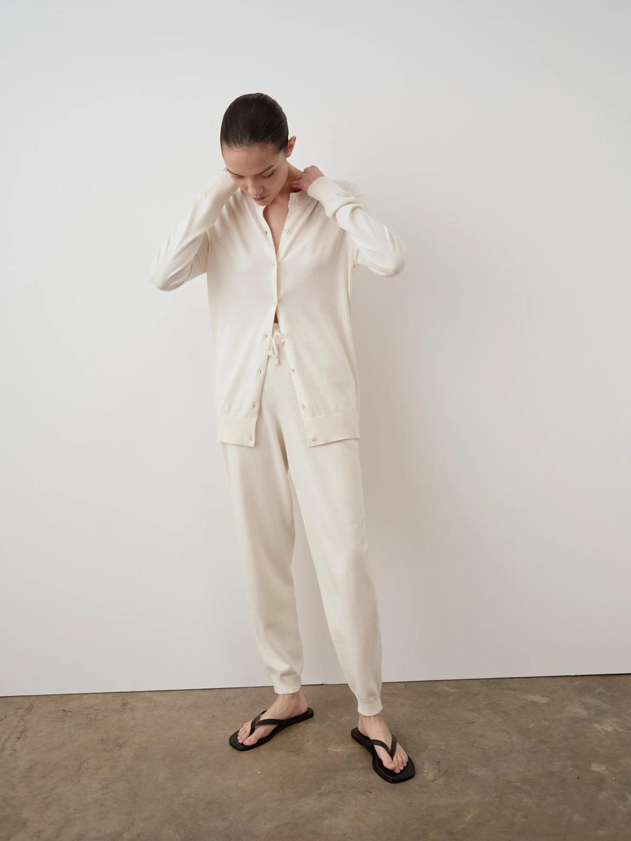 Emello Cotton Cashmere Cardigan in Cream, relaxed fit, worn by a model in a minimal setting.