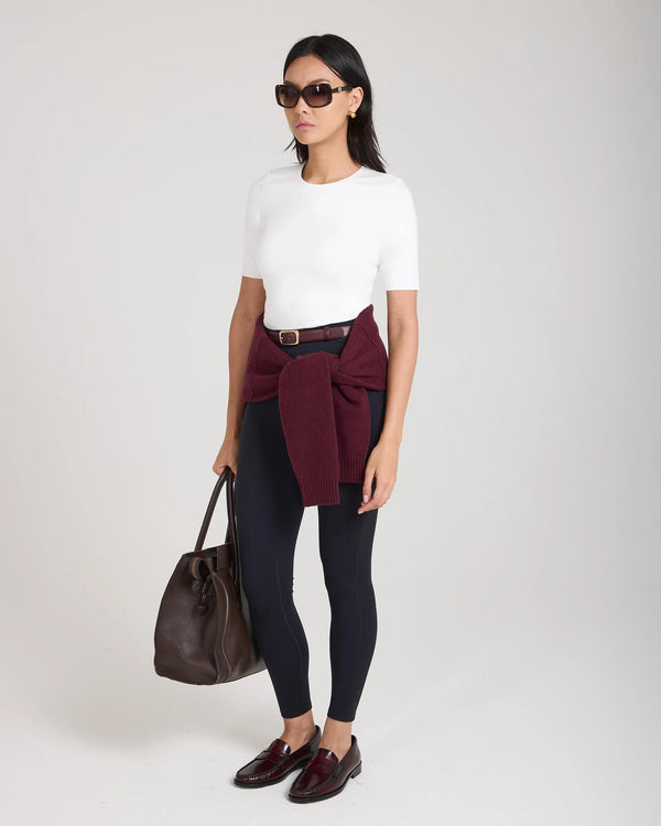 Emello Forma Silky Lyocell Jersey Double-Layer Top in cream, worn with burgundy sweater and brown leather bag.
