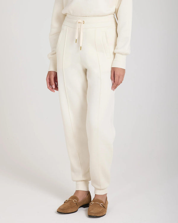 Cuffed trousers in brushed lyocell fleece with gold hardware and pockets, featuring a refined fit.
