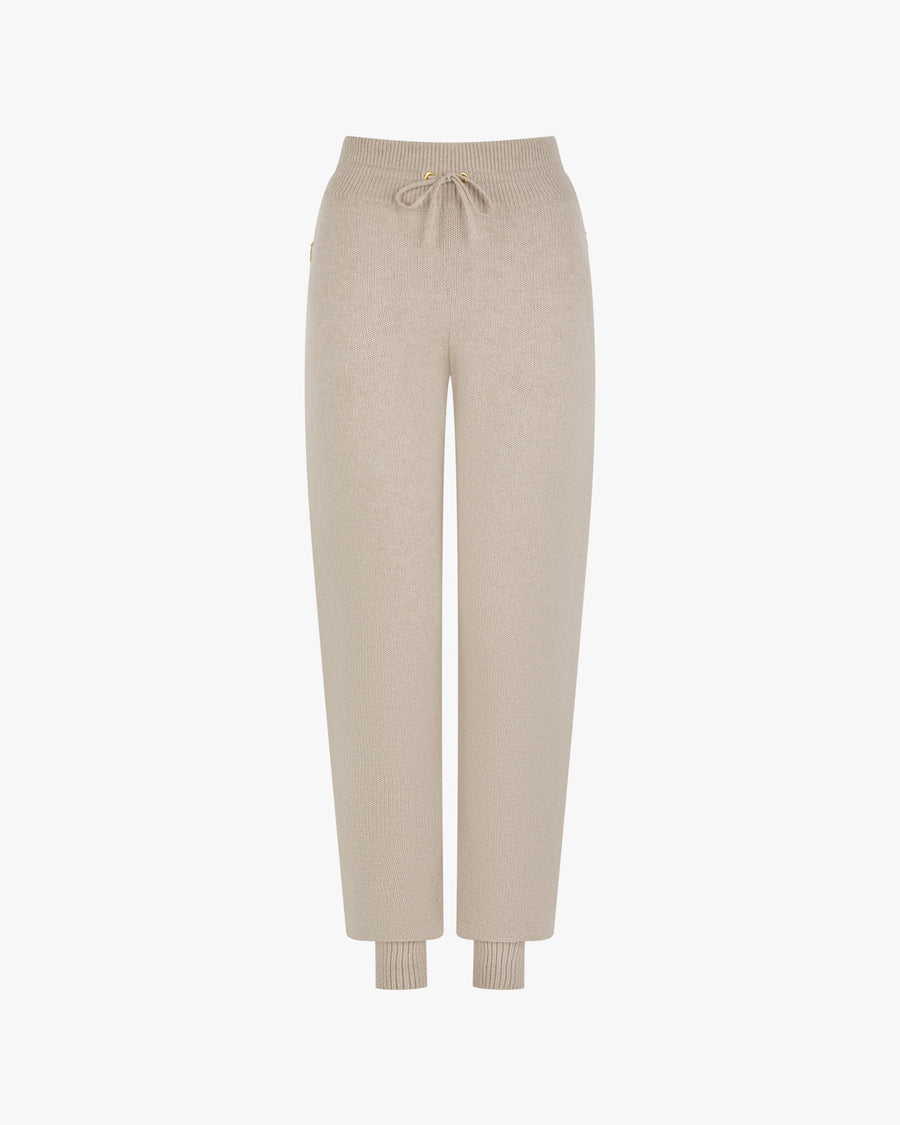 Beige cuffed trousers in merino wool-cashmere blend with gold hardware and zipped pockets.