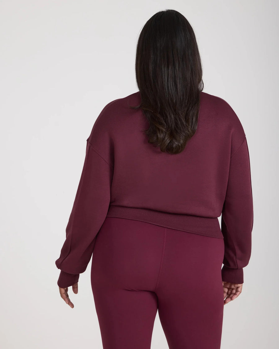 Back view of Emello's Fig sweatshirt with debossing in buttery-soft lyocell fleece