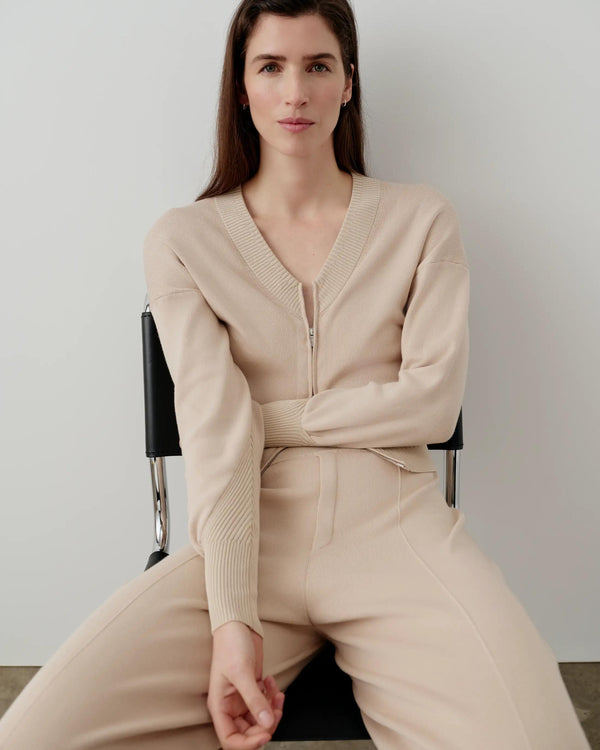Refined double waistband knitted trousers in neutral, showcasing tailored elegance.