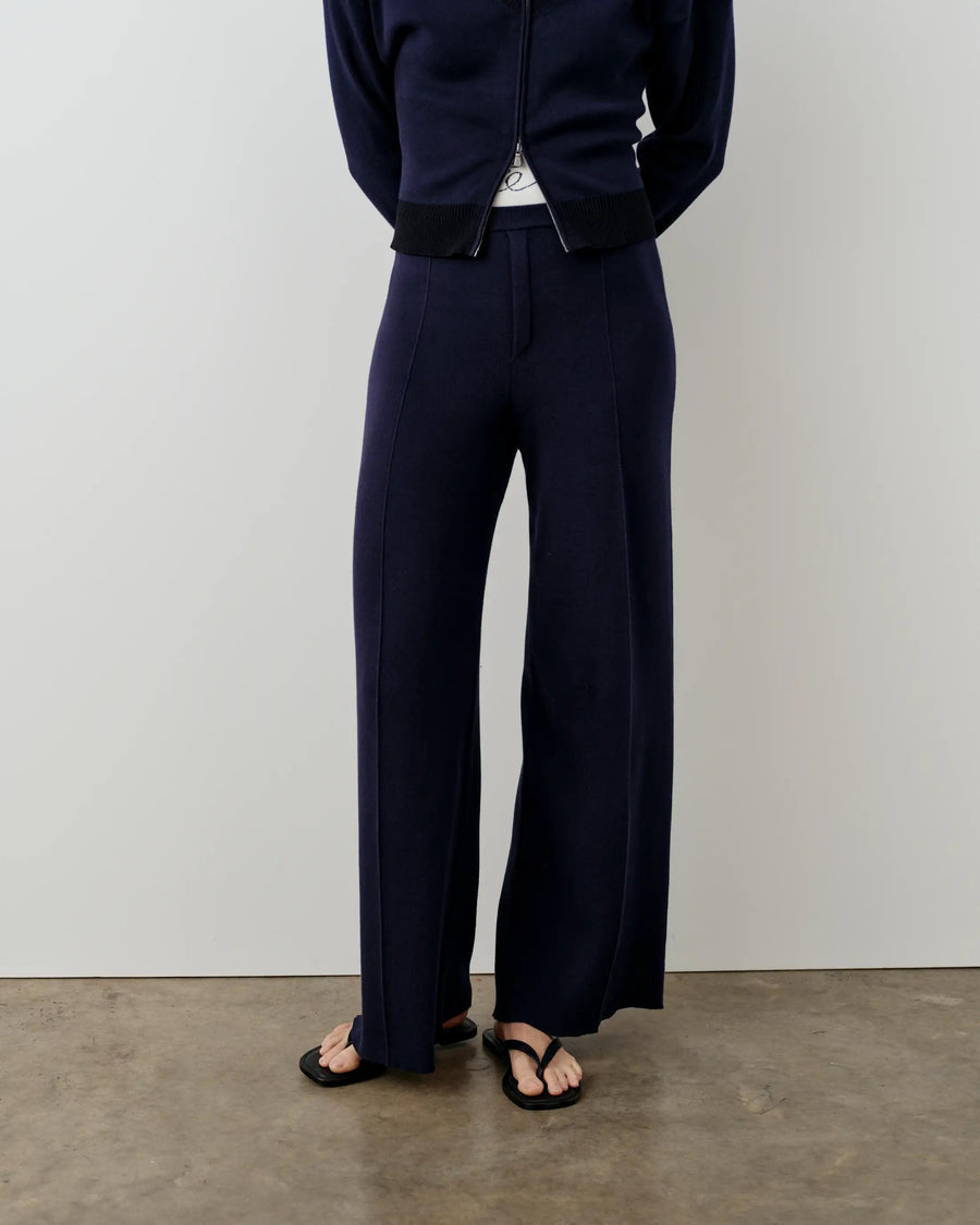 Navy double waistband knitted trousers with wide legs and a refined silhouette.