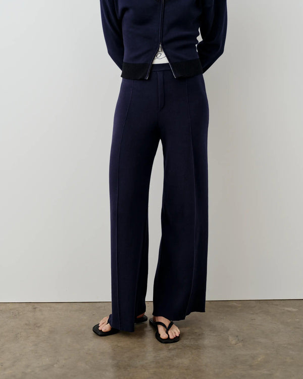 Navy double waistband knitted trousers with wide legs and a refined silhouette.