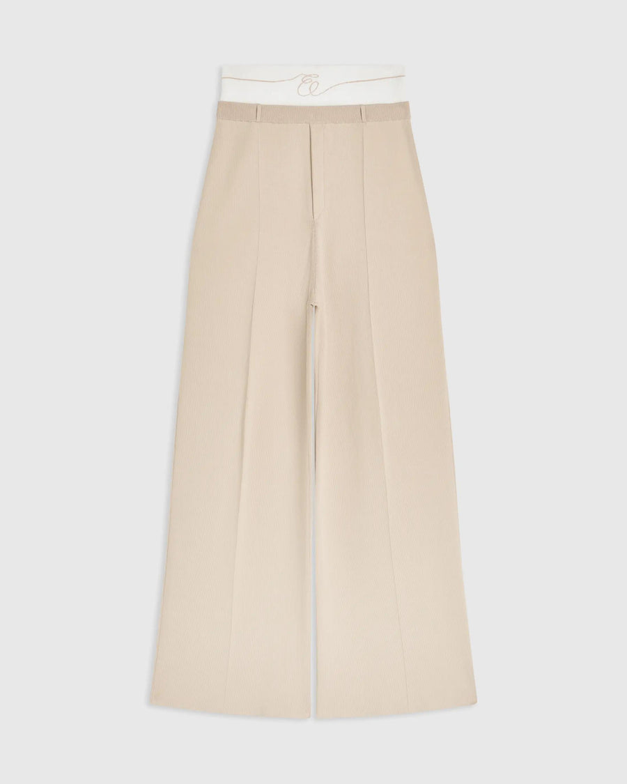 Double waistband knitted trousers in neutral tone featuring a wide-leg silhouette.