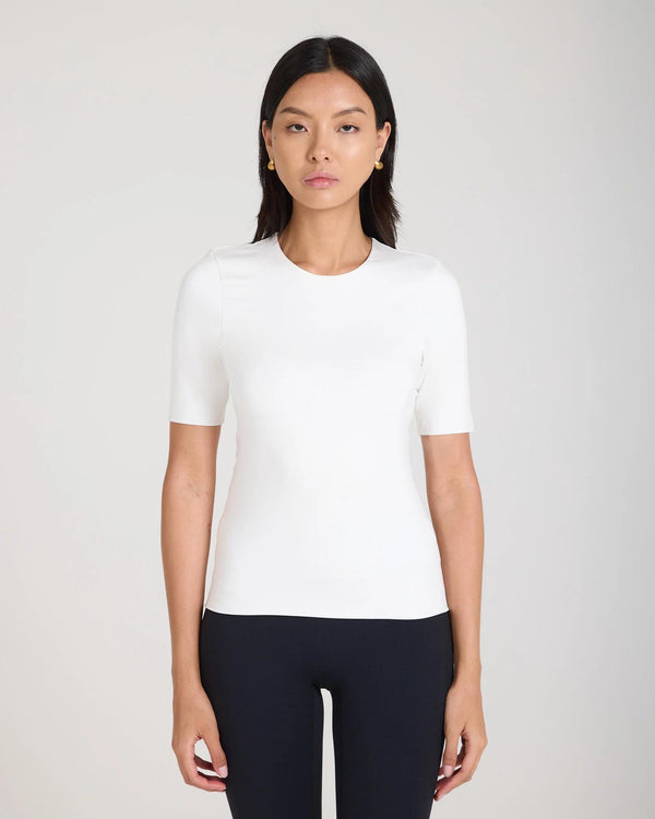 Woman wearing Emello Forma Silky Lyocell Jersey Double-Layer Top in Cream.