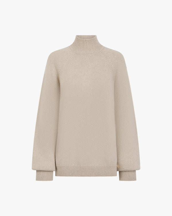 Elegant high-neck beige sweater crafted in fine merino wool and cashmere.
