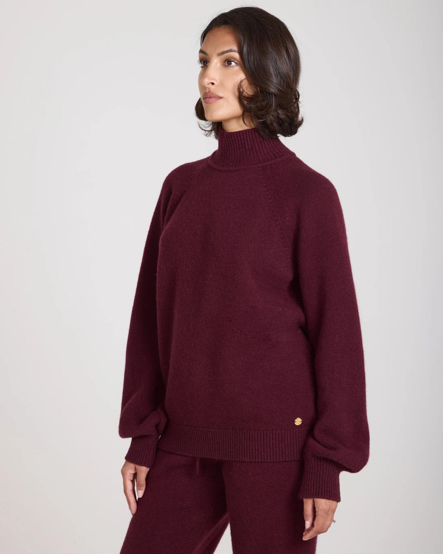 Kasima Cashmere Blend Knit Sweater in rich fig with a relaxed fit and rib funnel neck.