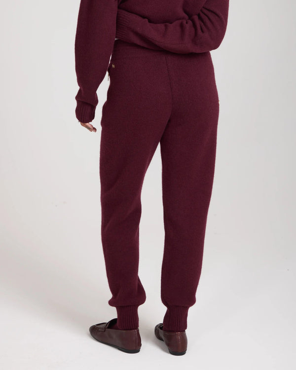 Kasima Cashmere Blend Knit Trousers in fig shown from the back, demonstrating the relaxed fit and ribbed cuffs.