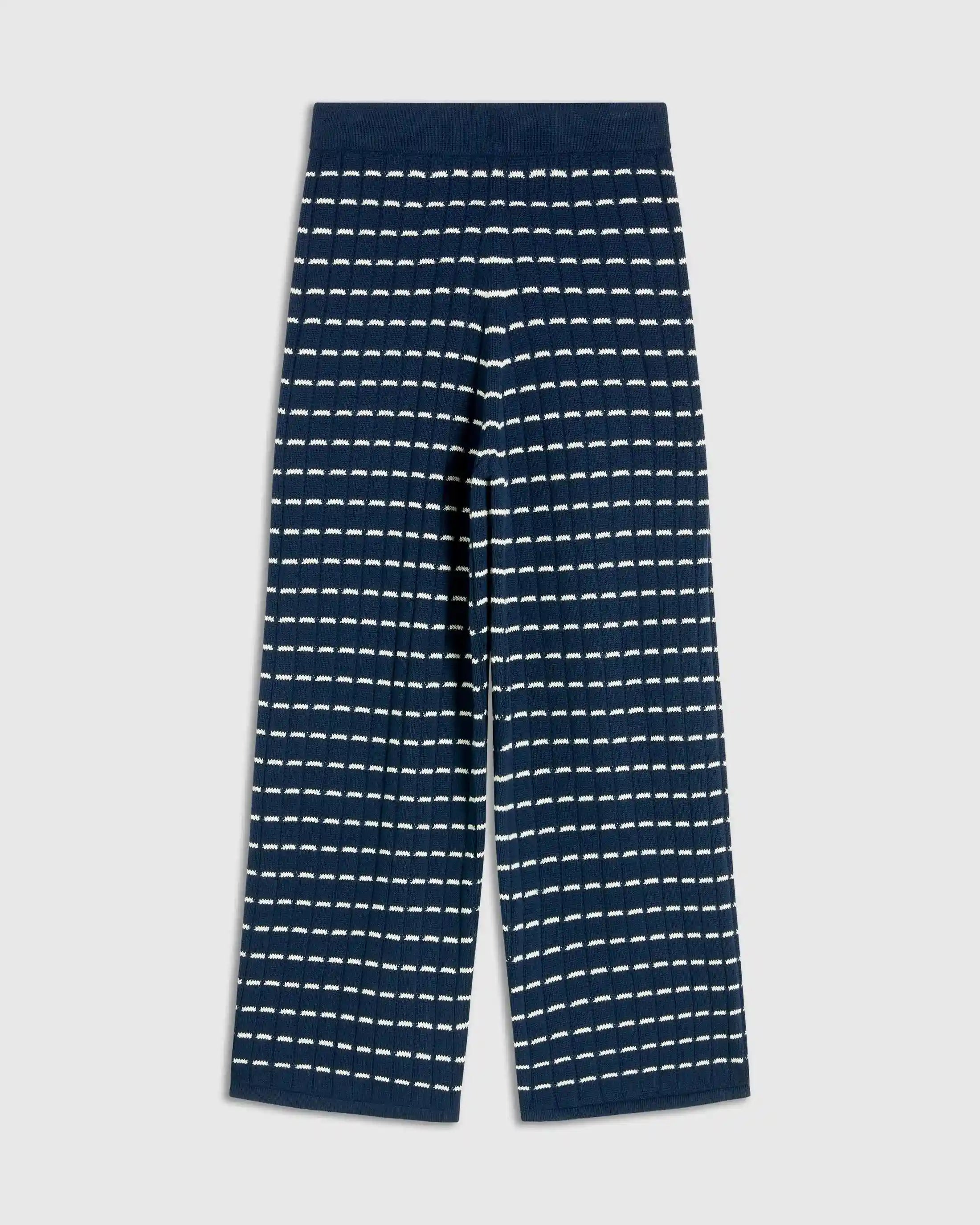 Navy blue pants with white stripe pattern on a light gray background