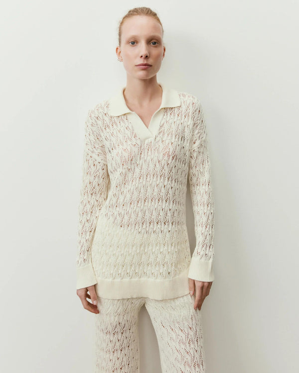 Cream Open Knit Polo Top made of 100% cotton, elegantly draped on a model, showcasing Italian craftsmanship and tactile elegance.