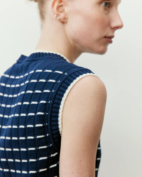 Navy and cream contrast pointelle knit vest from Emello with strong shoulders and ribbed detailing.