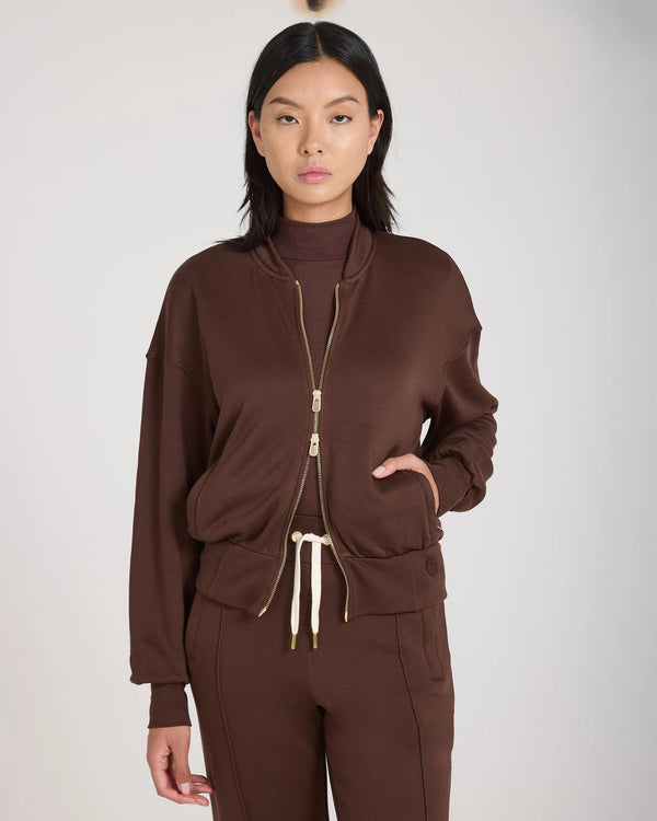 Mello Lyocell Fleece Zip-Through Jacket in Chocolate Brown, showcasing a relaxed fit and gold-finish embellishments.