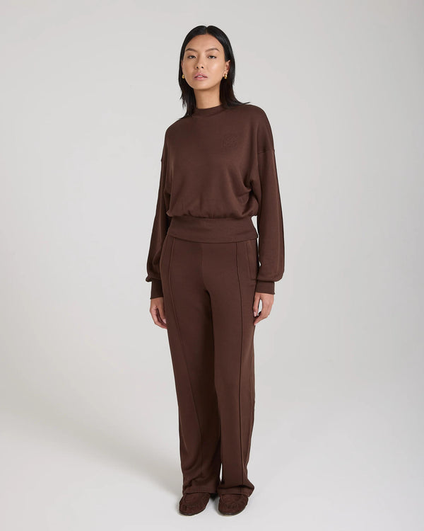 Chocolate brown Mello Lyocell Fleece Sweatshirt with debossing, relaxed fit, worn by a model.