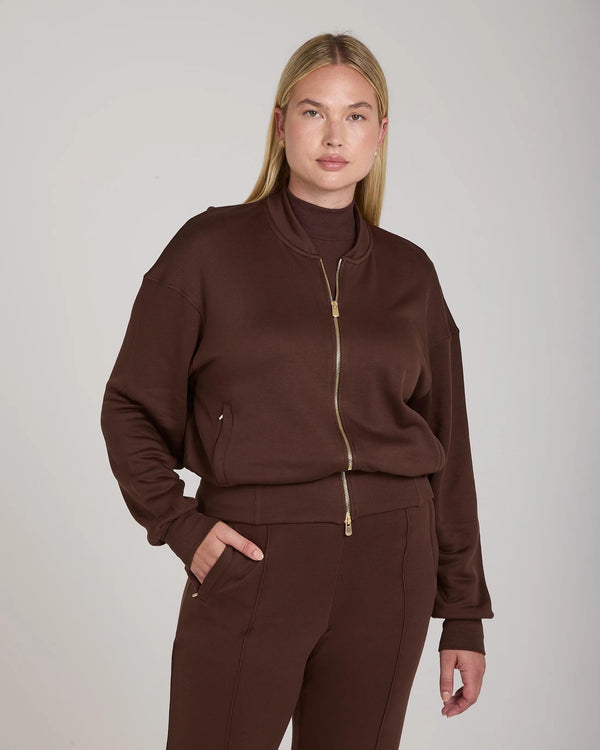 Mello Lyocell Fleece Zip-Through Jacket in Chocolate, relaxed fit with stand collar and gold-finish hardware, worn by model