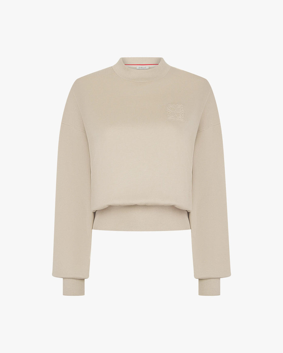 Beige lyocell sweatshirt with debossing on the chest, featuring ribbed cuffs and crew neck.
