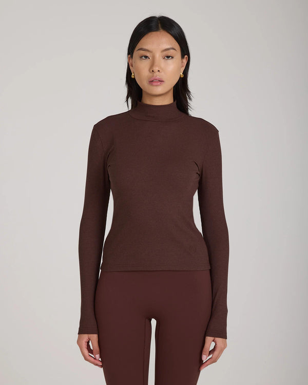 Emello chocolate brown Forma ribbed turtleneck top showcasing a high collar and slim silhouette.