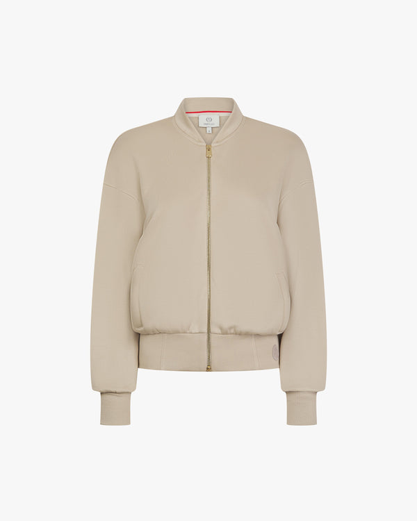 Beige zip-through jacket in buttery-soft lyocell fleece with gold hardware by Emello