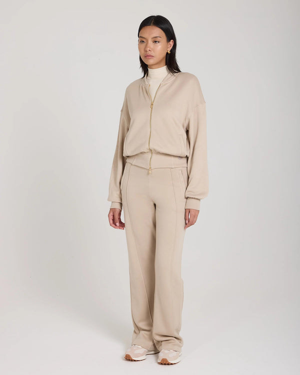 Mello Lyocell Fleece Zip-Through Jacket in beige, relaxed fit with gold-finish zip and embroidered details.
