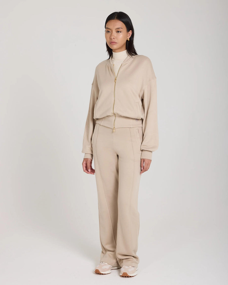 Mello Lyocell Fleece Zip-Through Jacket in beige, relaxed fit with gold-finish zip and embroidered details.