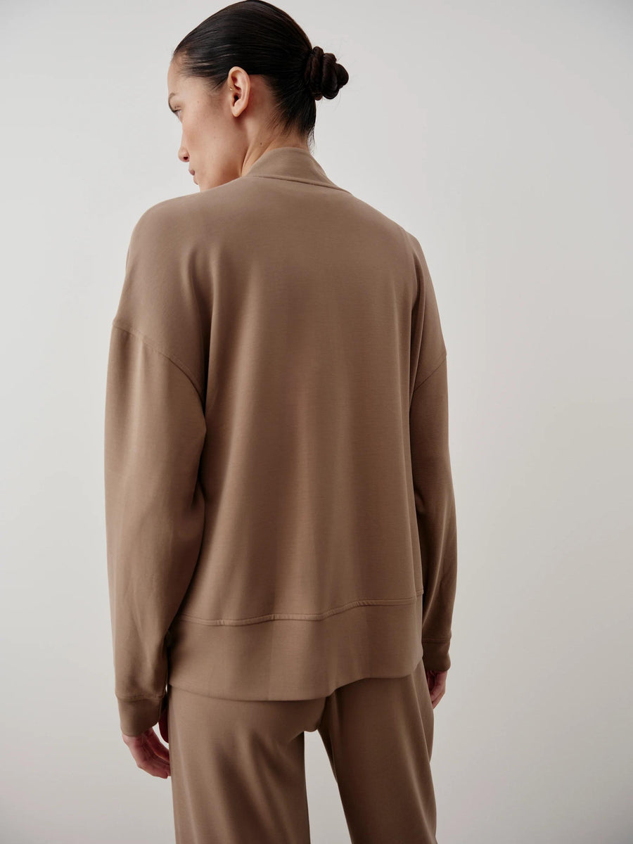 Back view of the Modal Popper Jacket in taupe, showcasing the collarless design and relaxed shoulders.