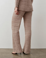 Open-knit trousers with a refined textured pattern and relaxed fit, crafted in Italy.