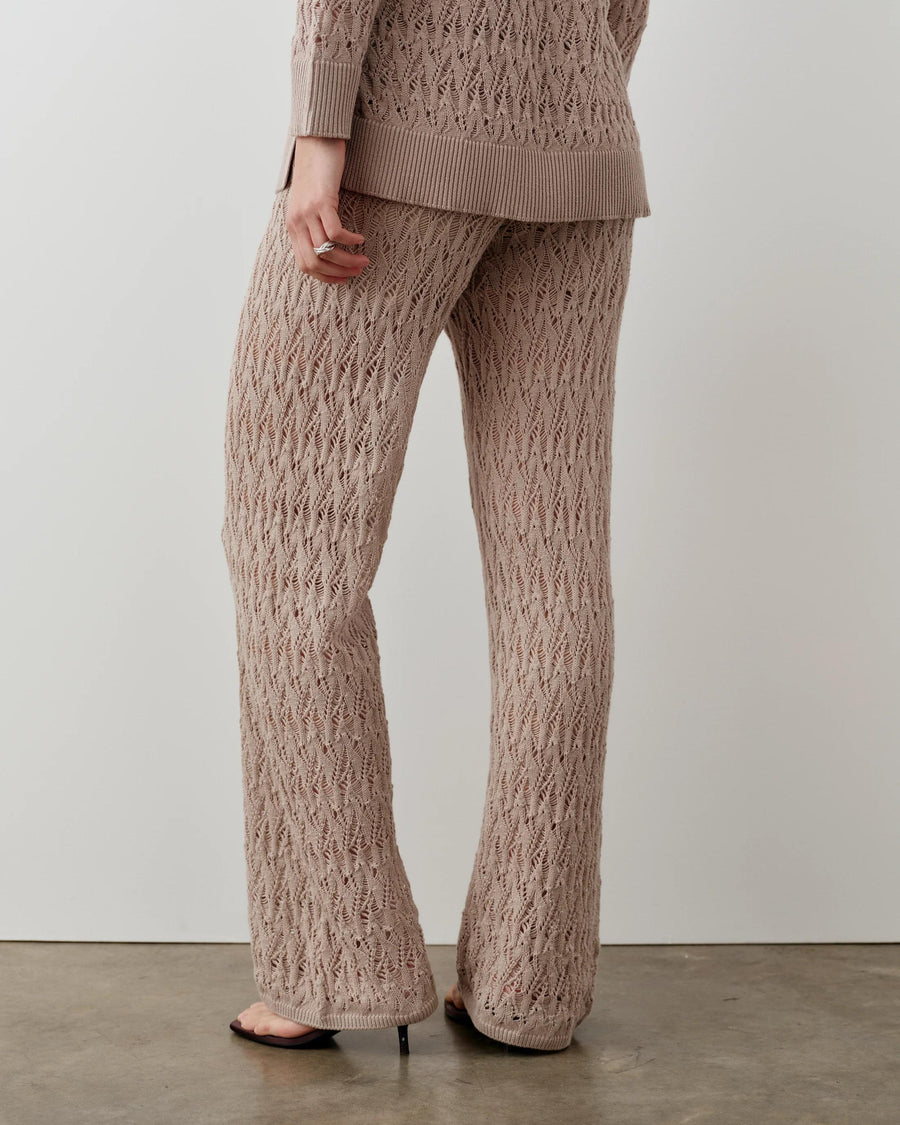 Open-knit trousers with a refined textured pattern and relaxed fit, crafted in Italy.