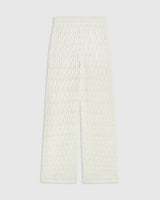 Elegant cream open knit trousers in relaxed straight-leg silhouette, crafted from 100% Italian cotton.