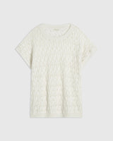 Emello Open Knit Short Sleeve Top in Cream, showcasing intricate open-stitch construction with soft drop shoulders.