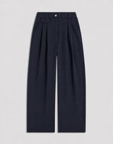 Pleated Wool Trousers in navy showcasing tailored wide-leg silhouette.